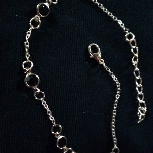 Gold anklet with black stones